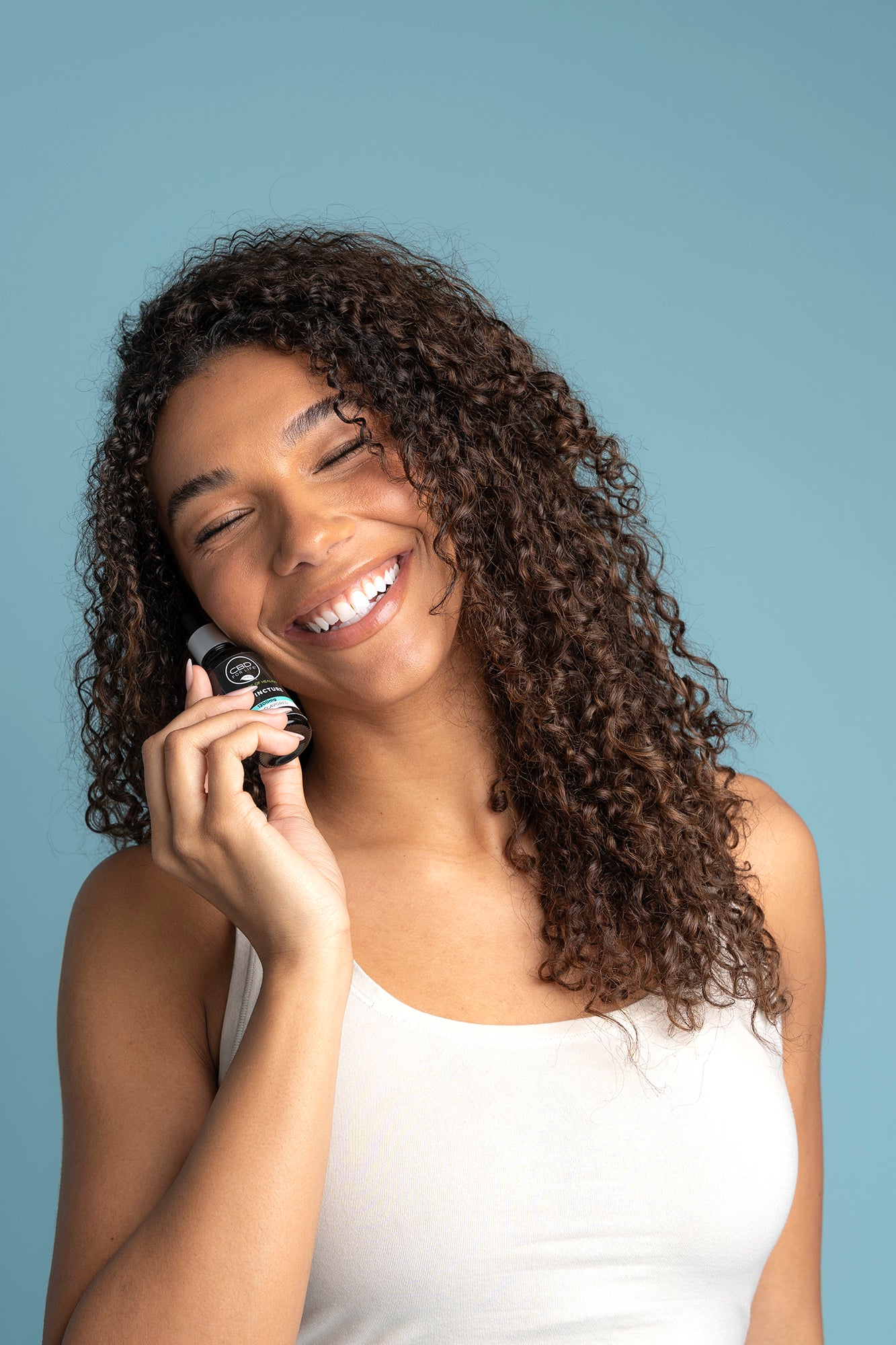 Woman holding a CBD Tincture