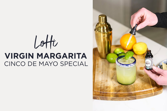 Someone adding LoHi THC Drops from CBD for Life to a virgin margarita