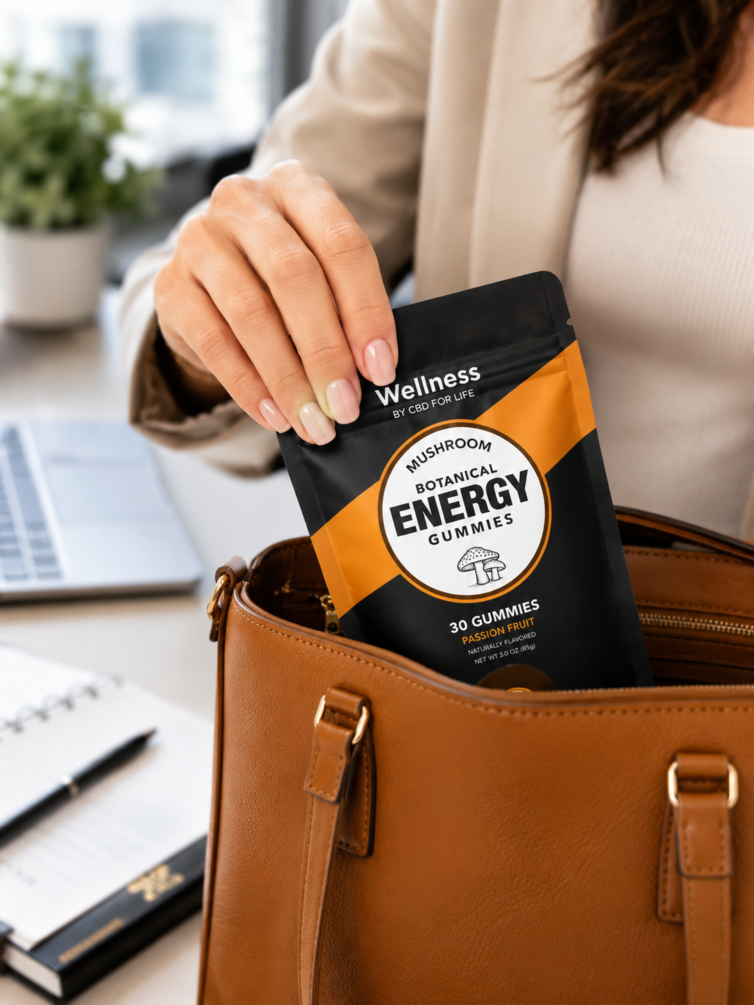 Adaptogenic energy gummies being taken out of a purse by a woman's hand.