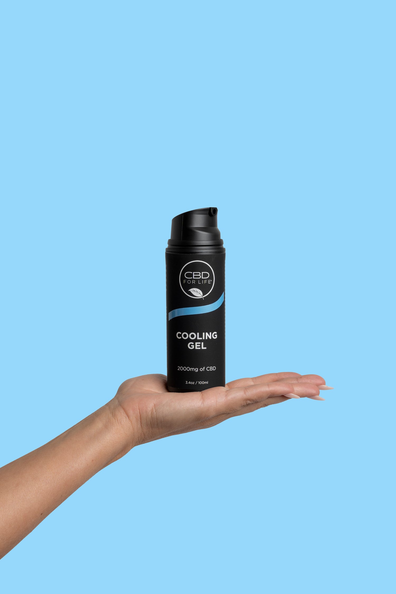 A woman holding a CBD cooling gel for pain relief.
