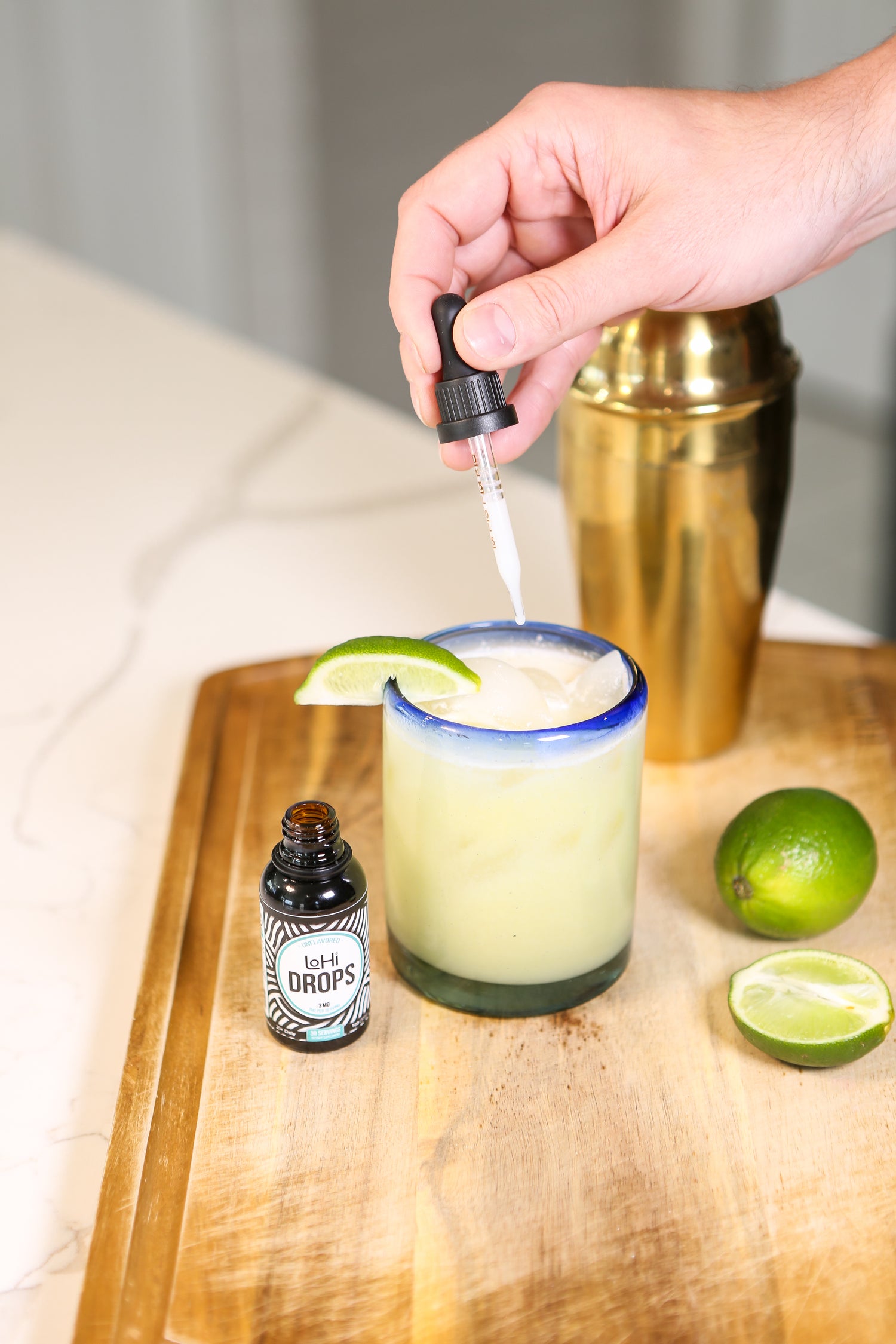 Adding LoHi THC drops to a pineapple coconut mockarita
