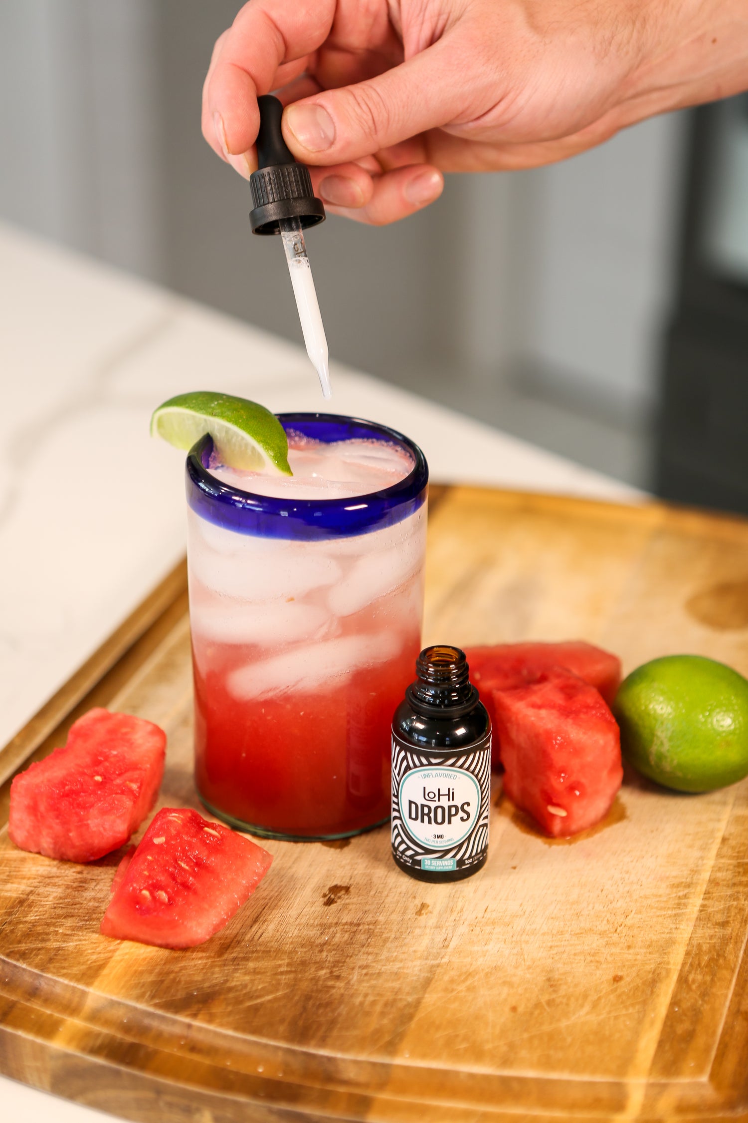 Adding LoHi THC drops to a watermelon spritz mocktail