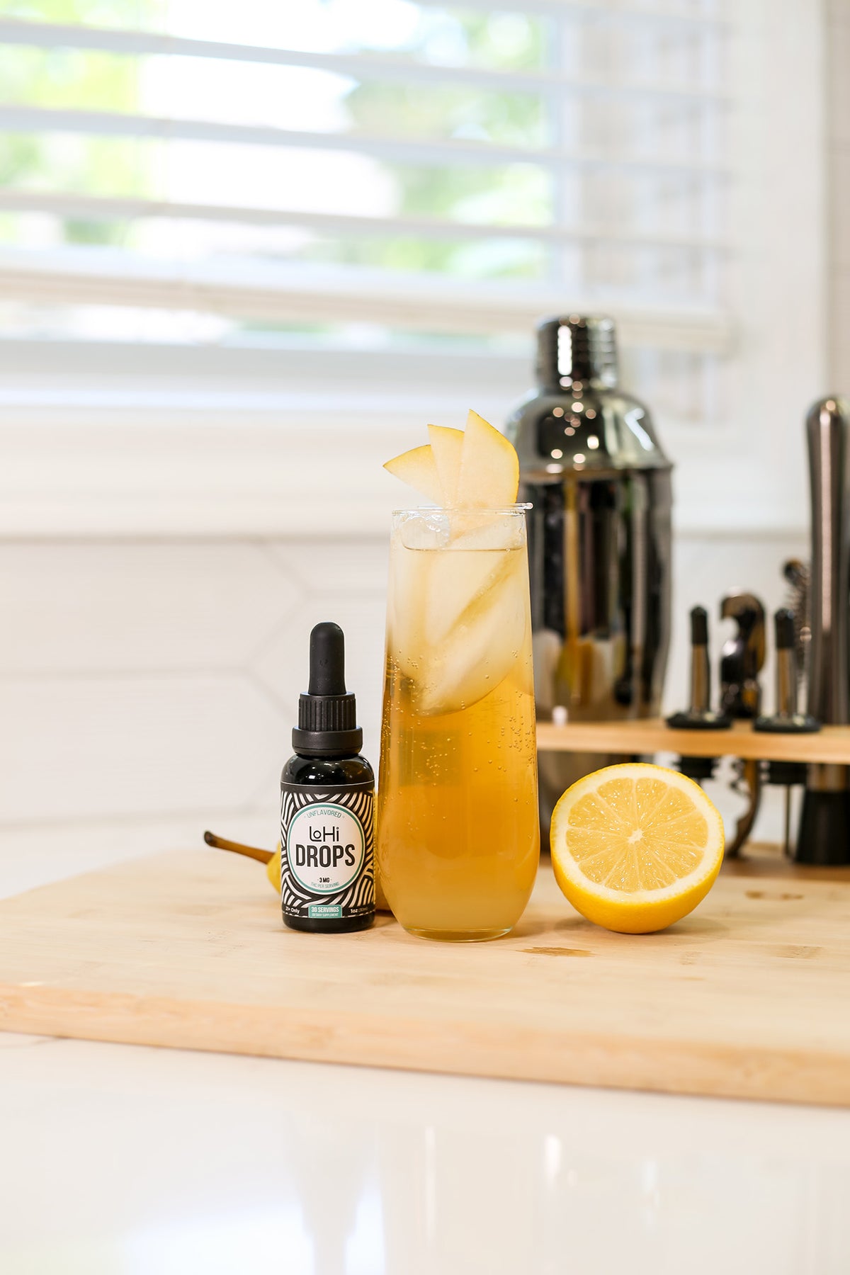 A non-alcoholic vanilla pear collins with THC drops